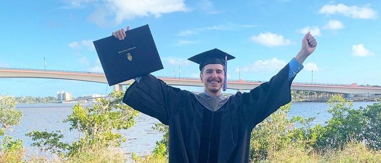 Scholarship recipient Stines shows excitement following his graduation from Palmer Florida